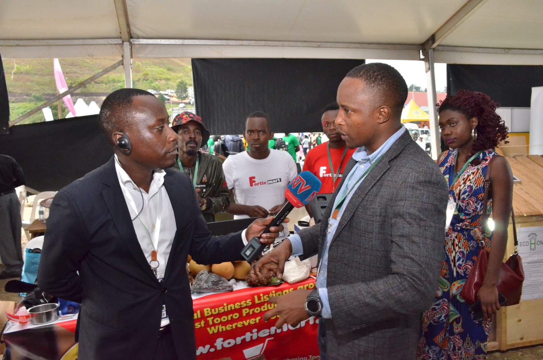 Edwin Mhumuza NTV interviews Robert Mugume fortiemart during Expo 2020